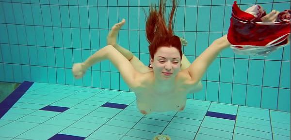  Hairy brunette teen Marketa underwater swimming